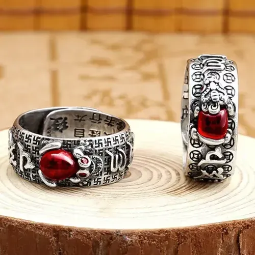 Pure silver pomegranate gemstone protective wealth ring. Order today and take away 5 boxes, a total of 10 pieces! Pure silver base with gold-plated puxiu,Pomegranate stone embedded for attracting wealth,and the ring body engraved with protective scriptures. Can be worn as a fashion statement, or given as a gift to convey double blessings. Let 10 auspicious and protective beasts adorn your fingertips, and your financial fortune will be securely in your grasp！