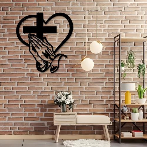 Elegant metal Christian heart-shaped cross wall decor, featuring praying hands design, suitable for indoor and outdoor use.  Iron art sculpture.