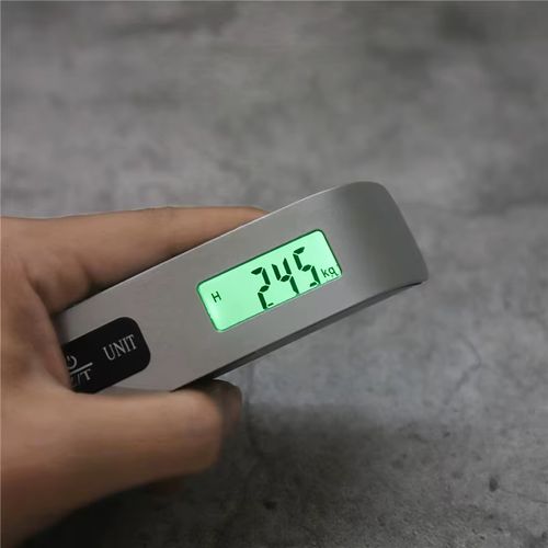 Portable electronic scale with digital LCD display.