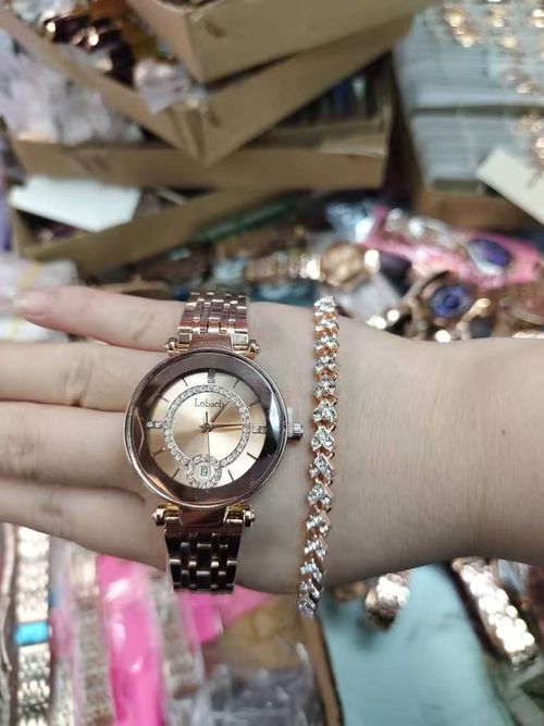 Gold high-fashion watch paired with a matching bracelet, featuring an ultra-thin quartz wristwatch and a polished gold stainless steel strap