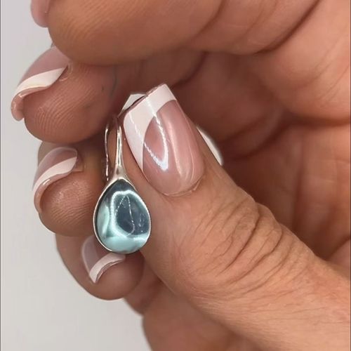 Bestselling teardrop diamond earrings with a sleek minimalist design, blending timeless fashion appeal and everyday elegance for the modern style lover