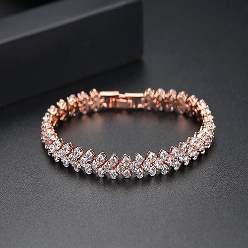 Gold high-fashion watch paired with a matching bracelet, featuring an ultra-thin quartz wristwatch and a polished gold stainless steel strap