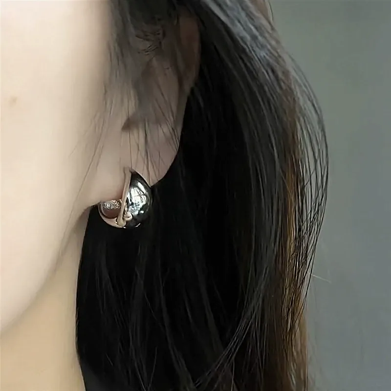 Geometric glossy silver teardrop ear studs