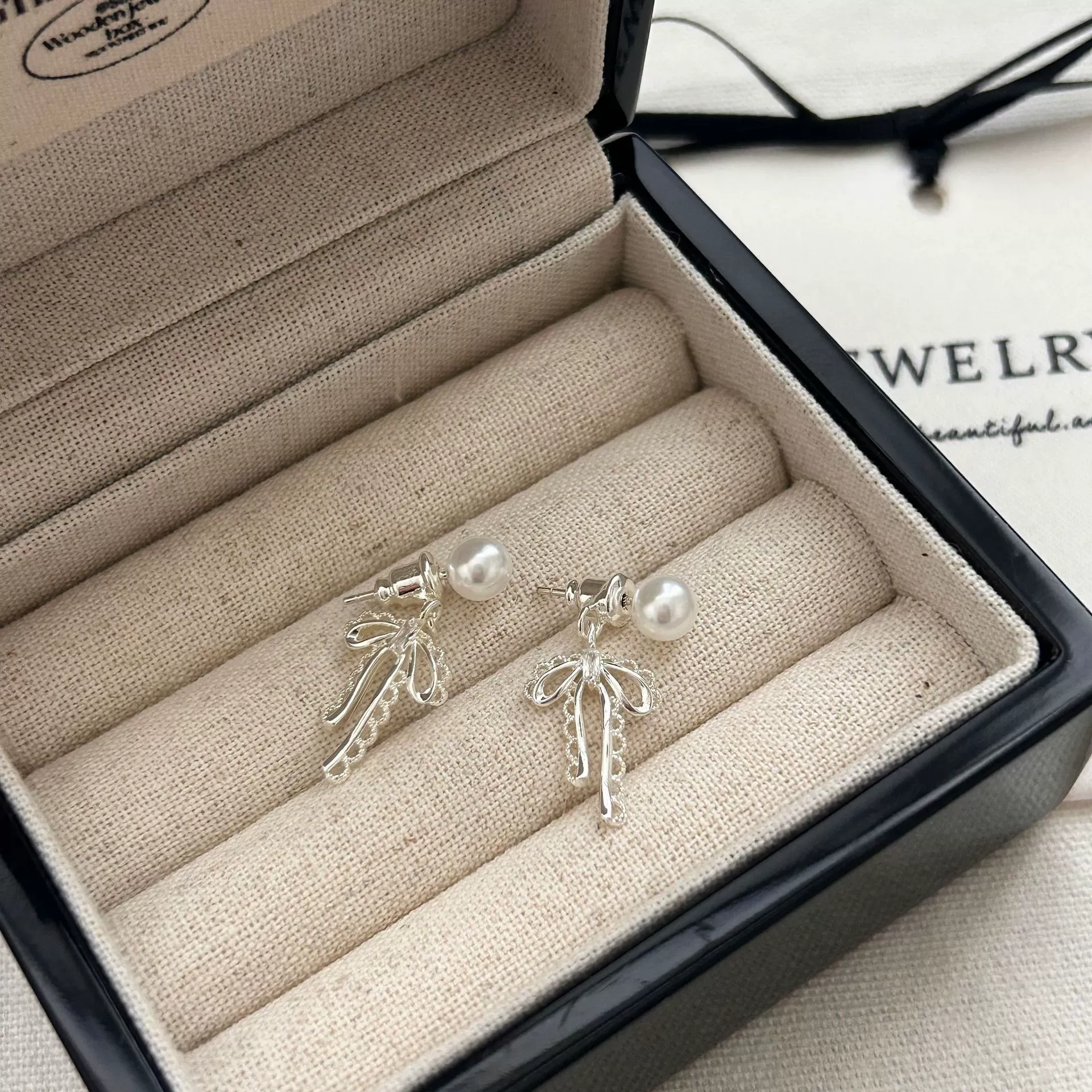 Ballet-style bow ear studs matte silver