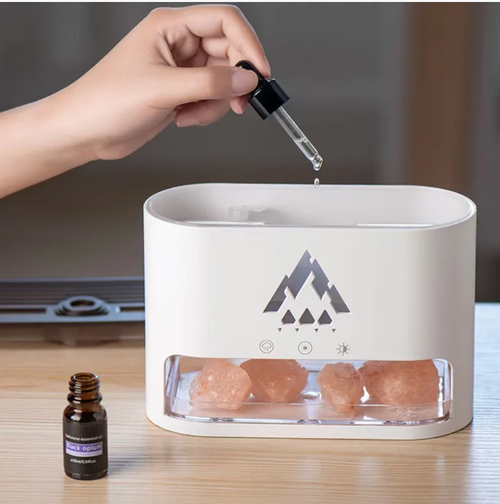 This flame aroma lamp: Simulates the warm glow of a campfire enveloping the jellyfish water mist. It diffuses fragrance and humidifies the air simultaneously. The RGB colored light can be switched. It is compatible with remote control for bed use. The bottom rock salt softens the light, which is suitable for both tabletop and bedside use. Turn it on during overtime or before sleep to make the solitary time gentle and soothing.