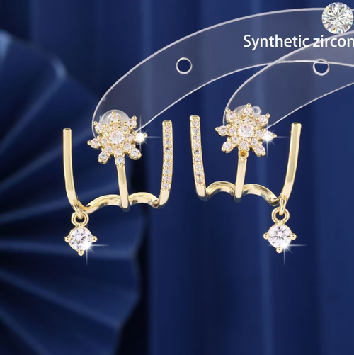 This octagonal star-shaped stud earrings feature an integrated curved design that fits the ear perfectly. The earrings are adorned with small zirconia stones and a delicate pendant, presenting a soft and lustrous appearance. The design is unique and trendy, with a Japanese-Korean style. They are suitable for both daily wear and social gatherings. Proper care during daily use can prevent bumps and exposure to chemicals, ensuring the long-term preservation of the jewelry's quality.