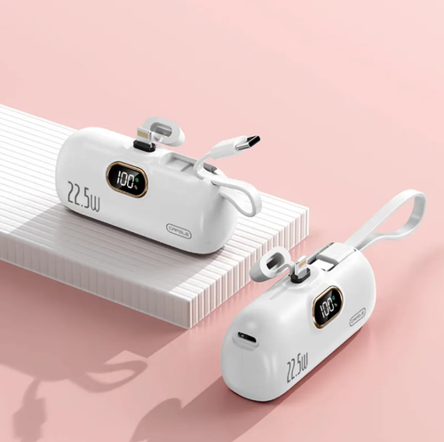 This capsule mini power bank has a capacity of 5000 milliampere and supports 22.5W fast charging. It has an integrated direct plug interface without the need for a data cable. It is equipped with an LED digital display screen for real-time battery level monitoring. It comes with a hanging strap for easy carrying and has multiple safety protections built-in, making it suitable for emergency power supply for mobile phones when going out.