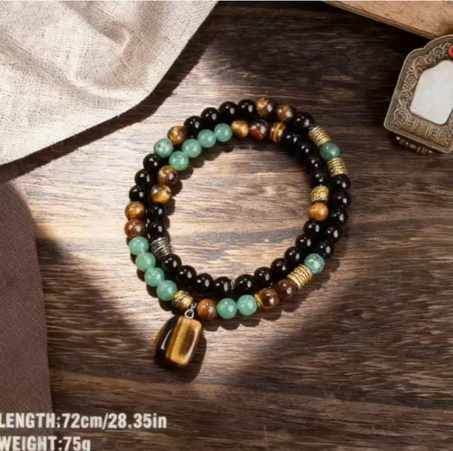 The Tiger Heart Stone Necklace combines the courage of Tiger Eye Stone, the stability of Black Onyx, and the vitality of Green Jadeite. The more you polish it, the more it will display the elegance of a fine piece of jewelry, embodying the strength of both hardness and softness, and conveying the essence of Eastern culture. If you place an order today, you will receive 2 Green Dongling Tiger Eye Stone Enhancing Fortune and Money Magnetic Stone Energy Necklaces.