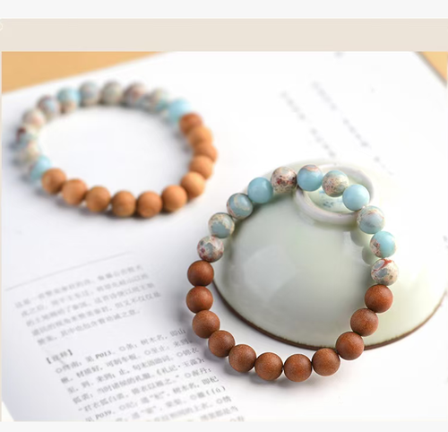 The Cliff Cypress Wealth Energy Bracelet is meticulously crafted using natural cliff cypress and rare gemstones such as Shoushan stone. It exudes a delicate fragrance that boosts energy and brings good fortune. The powerful energy gathers wealth. Order today and we will send you 10 Cliff Cypress Wealth Energy Bracelets. Wearing it will allow the power of nature to protect your path to wealth and keep good luck by your side.