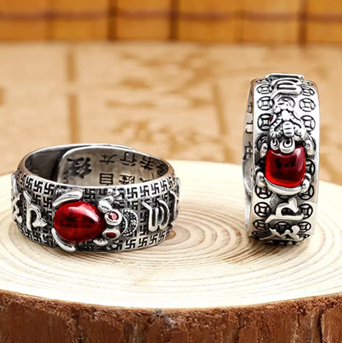 Pure silver pomegranate gemstone protective wealth ring. Order today and take away 5 boxes, a total of 10 pieces! Pure silver base with gold-plated puxiu,Pomegranate stone embedded for attracting wealth,and the ring body engraved with protective scriptures. Can be worn as a fashion statement, or given as a gift to convey double blessings. Let 10 auspicious and protective beasts adorn your fingertips, and your financial fortune will be securely in your grasp！