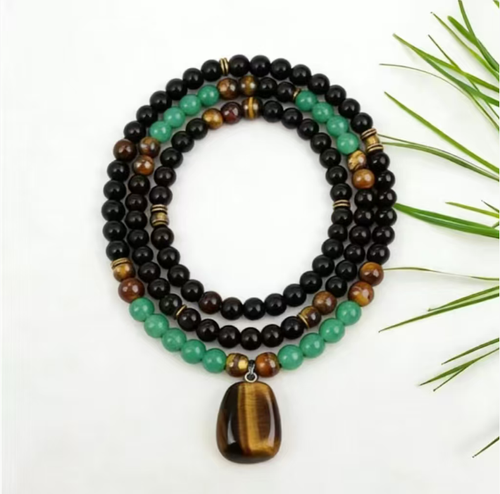 The Tiger Heart Stone Necklace combines the courage of Tiger Eye Stone, the stability of Black Onyx, and the vitality of Green Jadeite. The more you polish it, the more it will display the elegance of a fine piece of jewelry, embodying the strength of both hardness and softness, and conveying the essence of Eastern culture. If you place an order today, you will receive 2 Green Dongling Tiger Eye Stone Enhancing Fortune and Money Magnetic Stone Energy Necklaces.