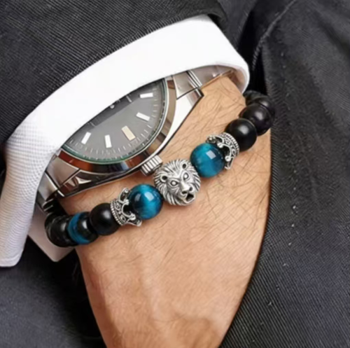 Order today and you will receive 2 pairs of the Eternal Love Tiger Eye Crown Ancient Gold and Silver Lion Head Buddha Bead Bracelets. The blue tiger eye stone can guide your vision, the black agate can balance your emotions, and the lion head can protect your energy. The beads are strung on a matte black frosted agate base, suitable for various style outfits. It comes with a precious gift box and is a wrist accessory that combines beauty and meaning.