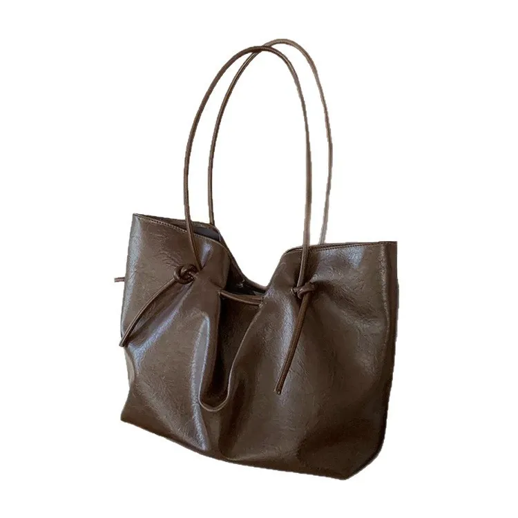 Retro brown tie-up tote bag for women, 2025 style, simple large-capacity commuter shoulder bag, fashionable handbag.