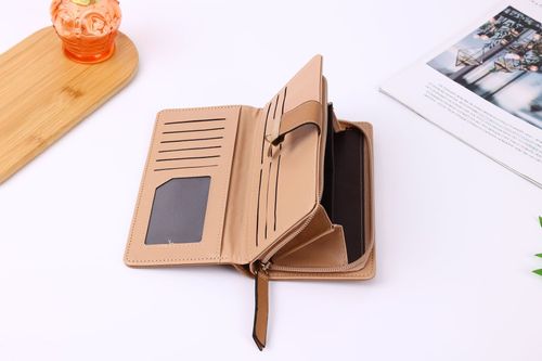 Designer perforated leather women's wallet, handbag, and phone case.