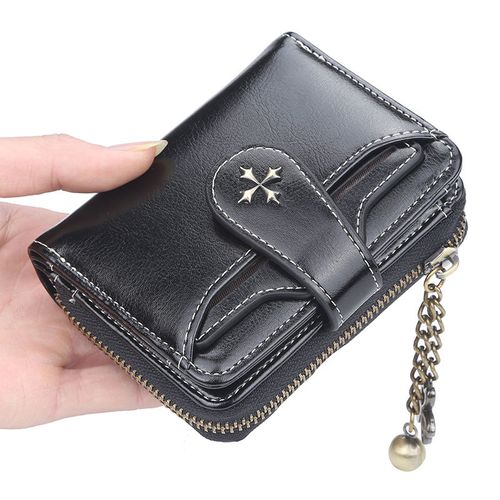 Miniature and stylish, this short wallet for men and women features a retro design, a zippered coin purse, and multiple compartments for cards and a driver's license.