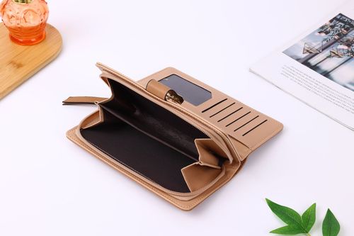 Designer perforated leather women's wallet, handbag, and phone case.