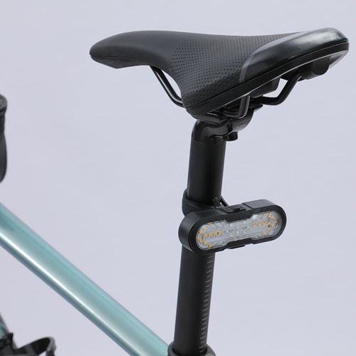 Remote control bicycle taillight with horn, turn signals, and USB charging, a warning light for night riding.
