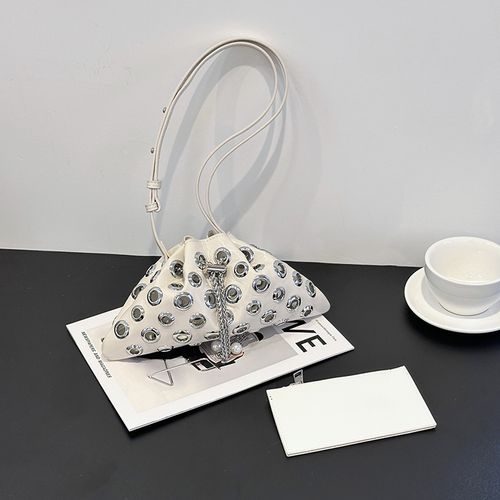 Stylish single-shoulder crossbody bag with openwork drawstring bucket bag, handle with underarm rivets, versatile small bag for women.