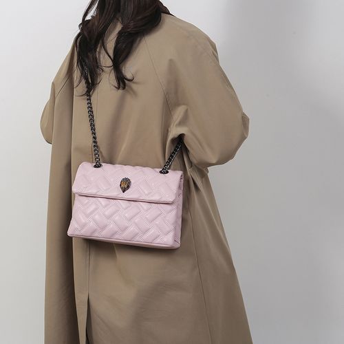 PU leather handbag with eagle head design, a unique and niche design, featuring a diamond-quilted pattern, chain strap, and flap closure.