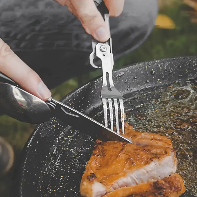A Versatile Folding Outdoor Tableware Set With 5 In 1, Including Knife, Fork, Spoon, Bottle Opener, Made Of Stainless Steel, Easy To Clean, And Comes With A Storage Bag, Perfect For Camping.