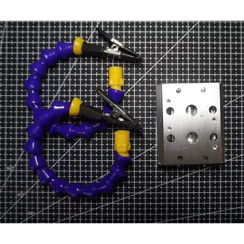 Multi-arm adjustable welding auxiliary tool