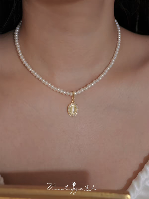 Colar de pérolas de água doce importado da Áustria, pingente de olho-de-gato natural, estilo divino de luxo, artesanato europeu, disponível em Angola com envio rápido.