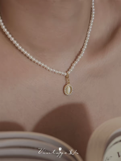 Colar de pérolas de água doce importado da Áustria, pingente de olho-de-gato natural, estilo divino de luxo, artesanato europeu, disponível em Angola com envio rápido.