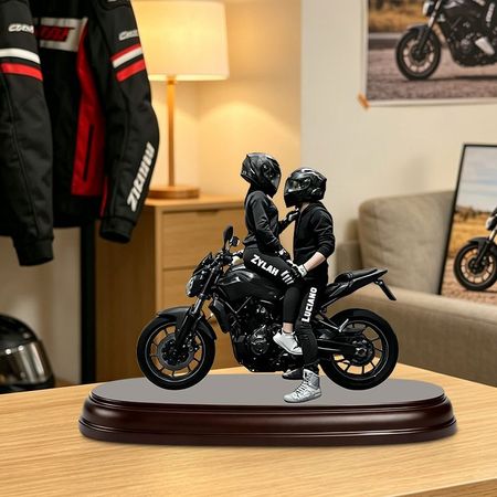 Custom acrylic figurine depicting a couple on a motorcycle