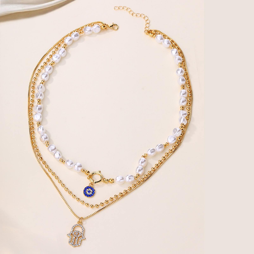 Multi-layered necklace with a gold-plated alloy pearl pendant.