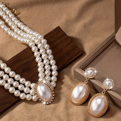 A pair of fashionable earrings and an exquisite vintage necklace