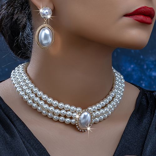 A pair of fashionable earrings and an exquisite vintage necklace