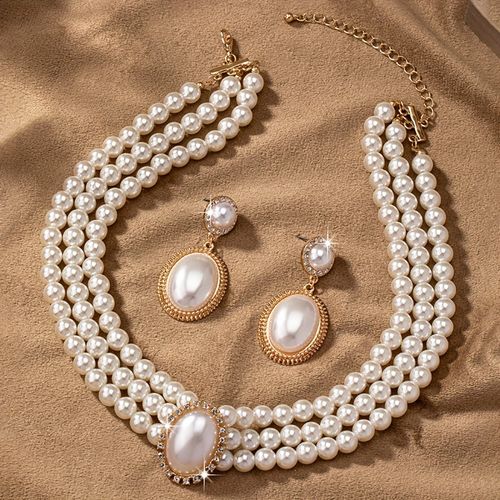 A pair of fashionable earrings and an exquisite vintage necklace