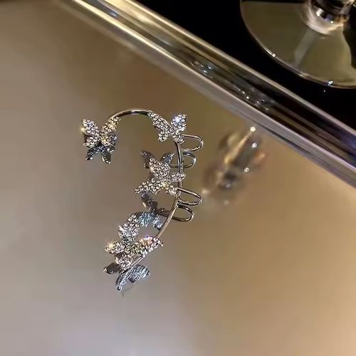 A pair of exquisite perforated crystal butterfly earrings with sparkling chilled cubic zirconia diamond pearl fashion clip-on earrings