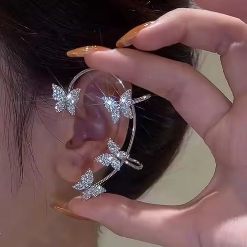 A pair of exquisite perforated crystal butterfly earrings with sparkling chilled cubic zirconia diamond pearl fashion clip-on earrings