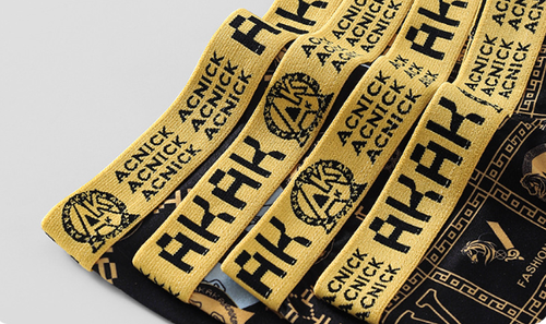 Men's underwear for hair distribution: black and gold briefs