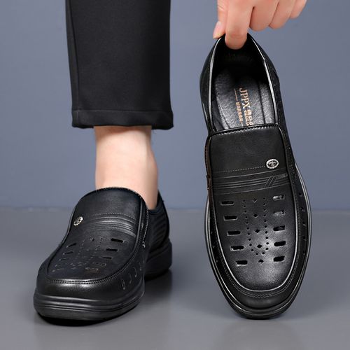 A man in leather sandals. A man in real cowhide sandals