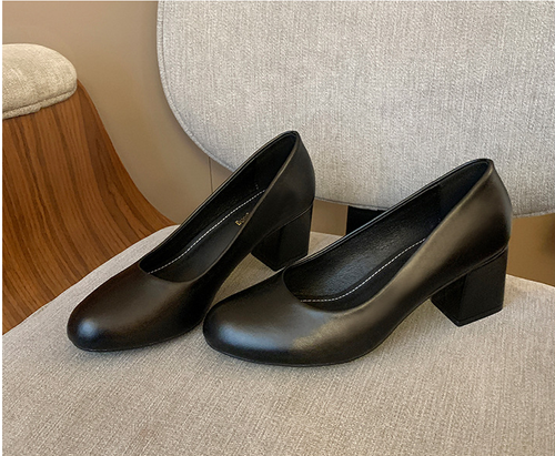 Black leather shoes with thick heels