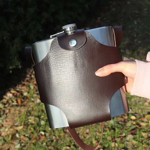 Stainless steel hip flask with leather sheath