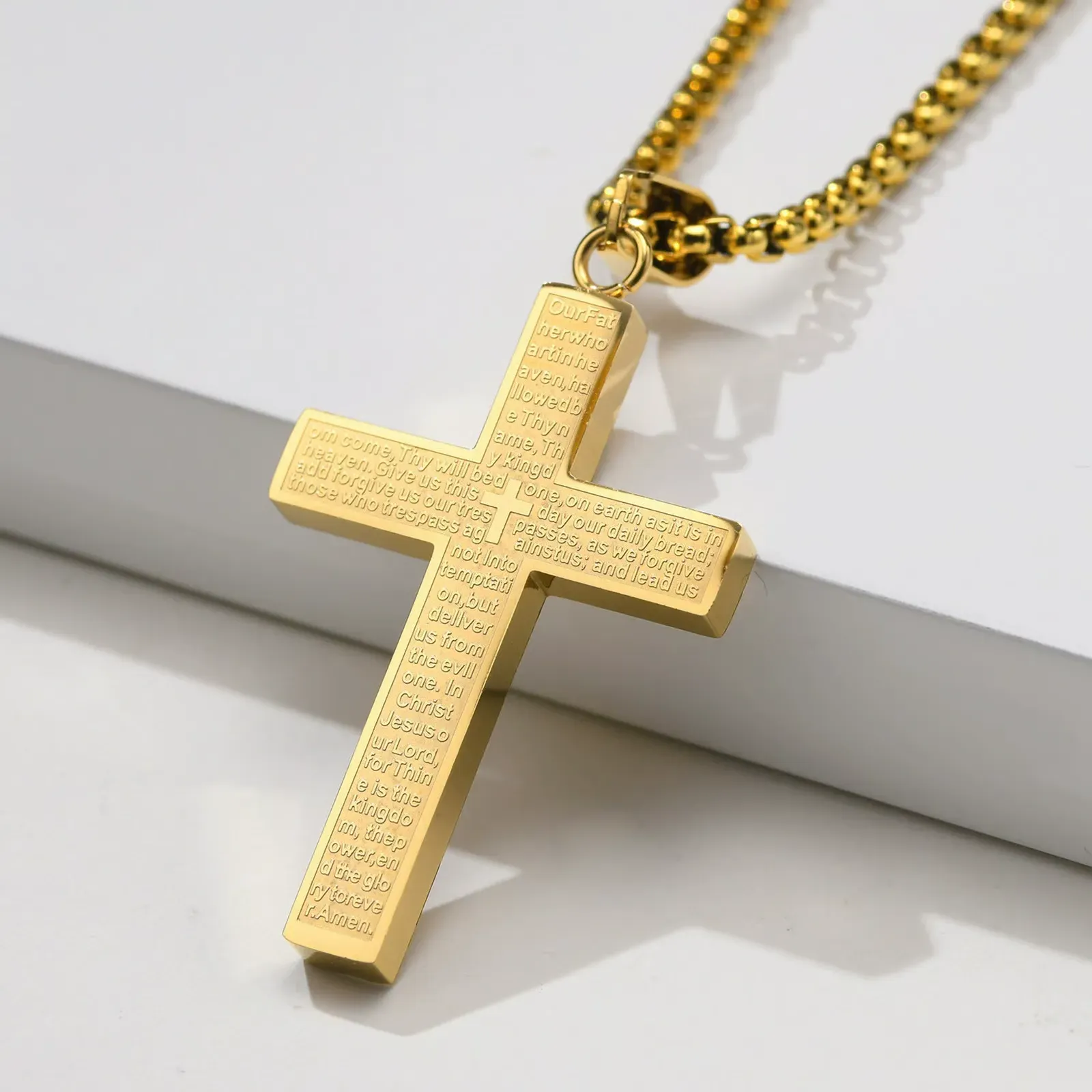 Necklace with a cross and the Lord's Prayer.