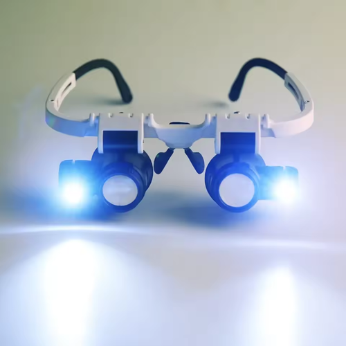 Dual lens jewelry magnifying glass with LED headphone lighting