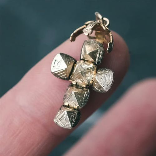 Two-way wearable transforming sphere and cross pendant