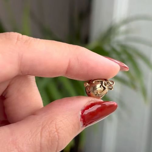 Two-way wearable transforming sphere and cross pendant