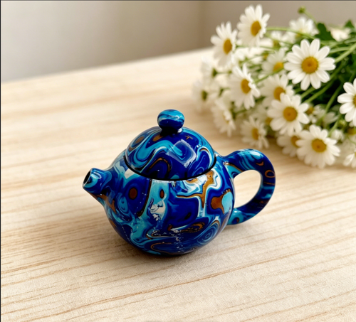 Creative rotating teapot lighter