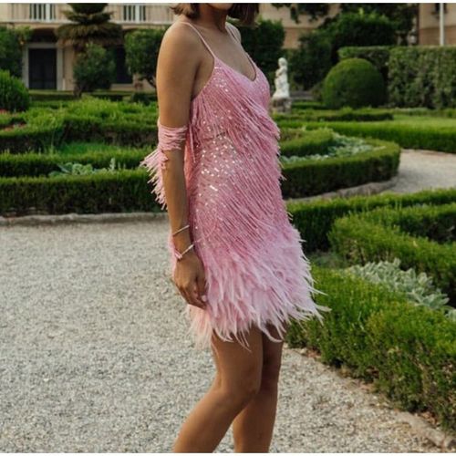 Women's dress with feather fringe and sequined spaghetti straps