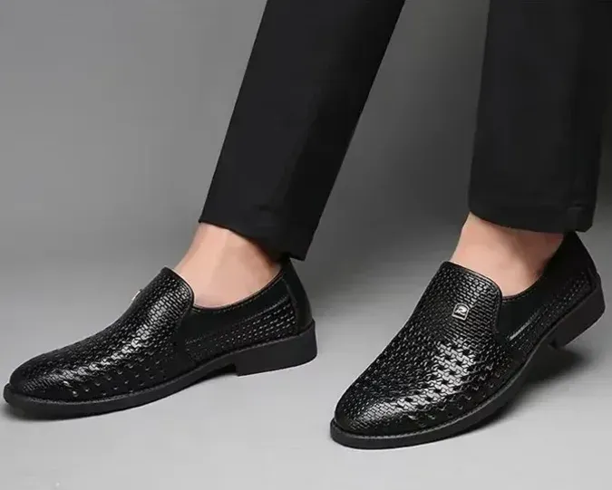 Black breathable perforated leather shoes