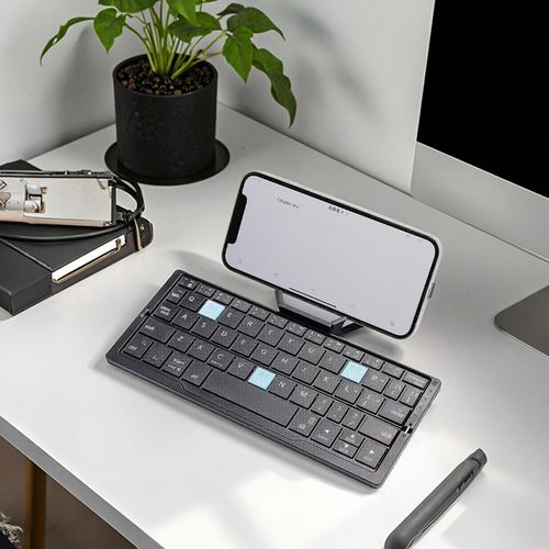 Mini folding 60-key scissor-switch keyboard, portable, rechargeable, silent aluminum alloy casing.