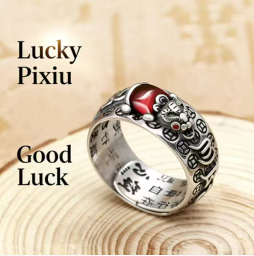 Pure silver pomegranate gemstone protective wealth ring. Order today and take away 5 boxes, a total of 10 pieces! Pure silver base with gold-plated puxiu,Pomegranate stone embedded for attracting wealth,and the ring body engraved with protective scriptures. Can be worn as a fashion statement, or given as a gift to convey double blessings. Let 10 auspicious and protective beasts adorn your fingertips, and your financial fortune will be securely in your grasp！
