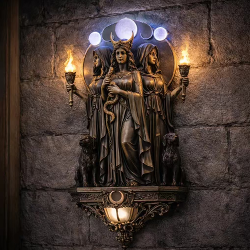 Hecate Triple Goddess Resin Wall Lamp. The resin has an antique bronze texture and rich detailed engravings. It features classic elements such as the moon phase and hunting dogs. There are simulated flames emitting warm light on both sides, serving as supplementary ambient lighting. It can be wall-mounted and is suitable for use in retro living rooms or as wall decorations in distinctive stores. It is purely for decoration and should not be used as the main light source.
