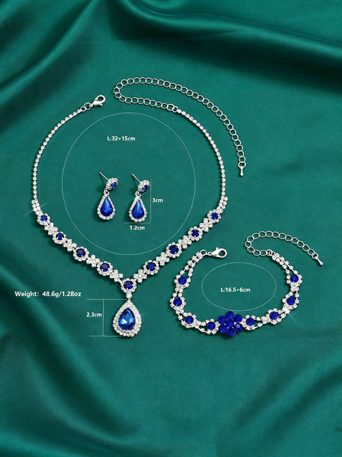 New stylish and luxurious crystal gemstone teardrop necklace, earring, and bracelet set.