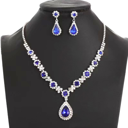 New stylish and luxurious crystal gemstone teardrop necklace, earring, and bracelet set.